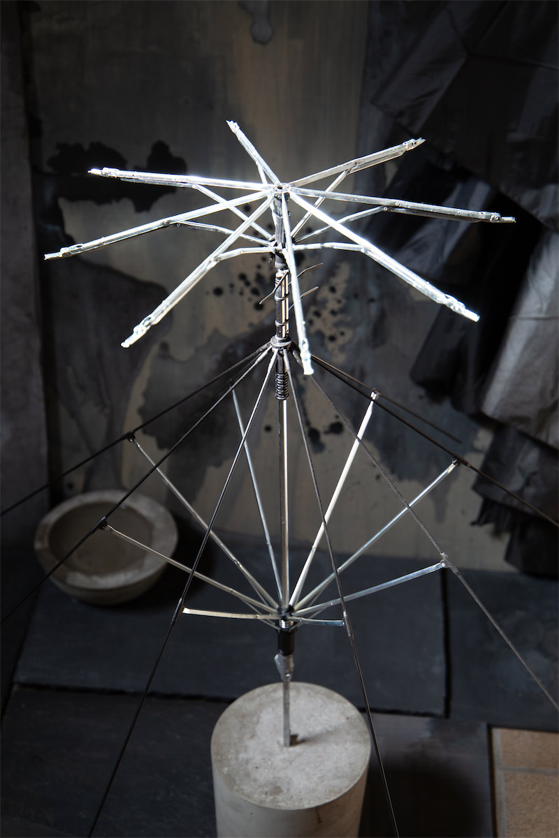 installation view sculptural moving image collaged installation with single channel 4K video projection, paint, linen, wood, stainless steel, nylon, concrete, water, stone slate