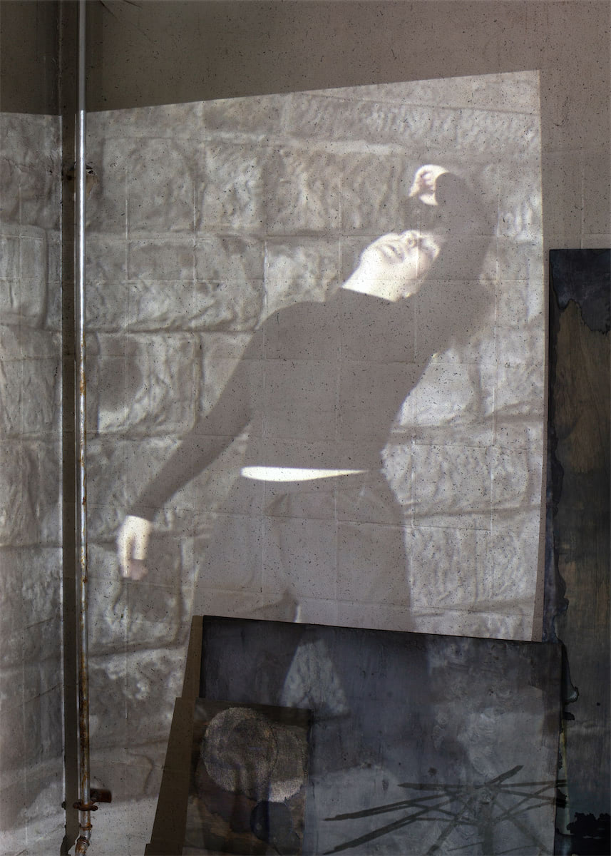 installation view sculptural moving image collaged installation with single channel 4K video projection, paint, linen, wood, stainless steel, nylon, concrete, water, stone slate