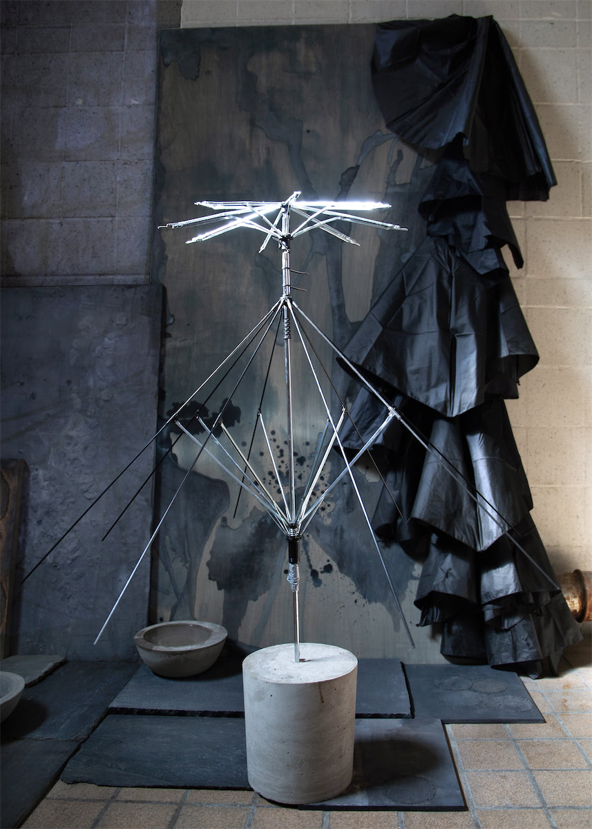 installation view sculptural moving image collaged installation with single channel 4K video projection, paint, linen, wood, stainless steel, nylon, concrete, water, stone slate