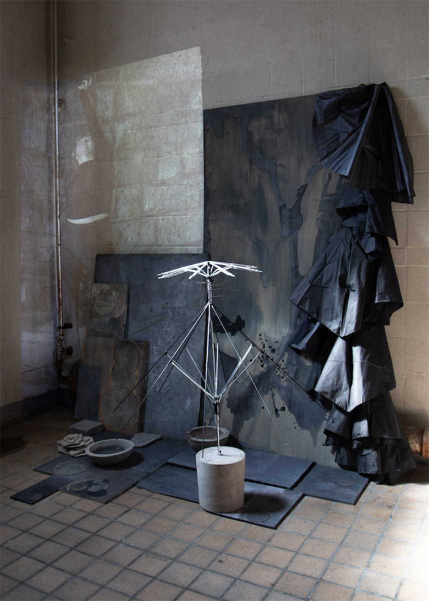 installation view sculptural moving image collaged installation with single channel 4K video projection, paint, linen, wood, stainless steel, nylon, concrete, water, stone slate